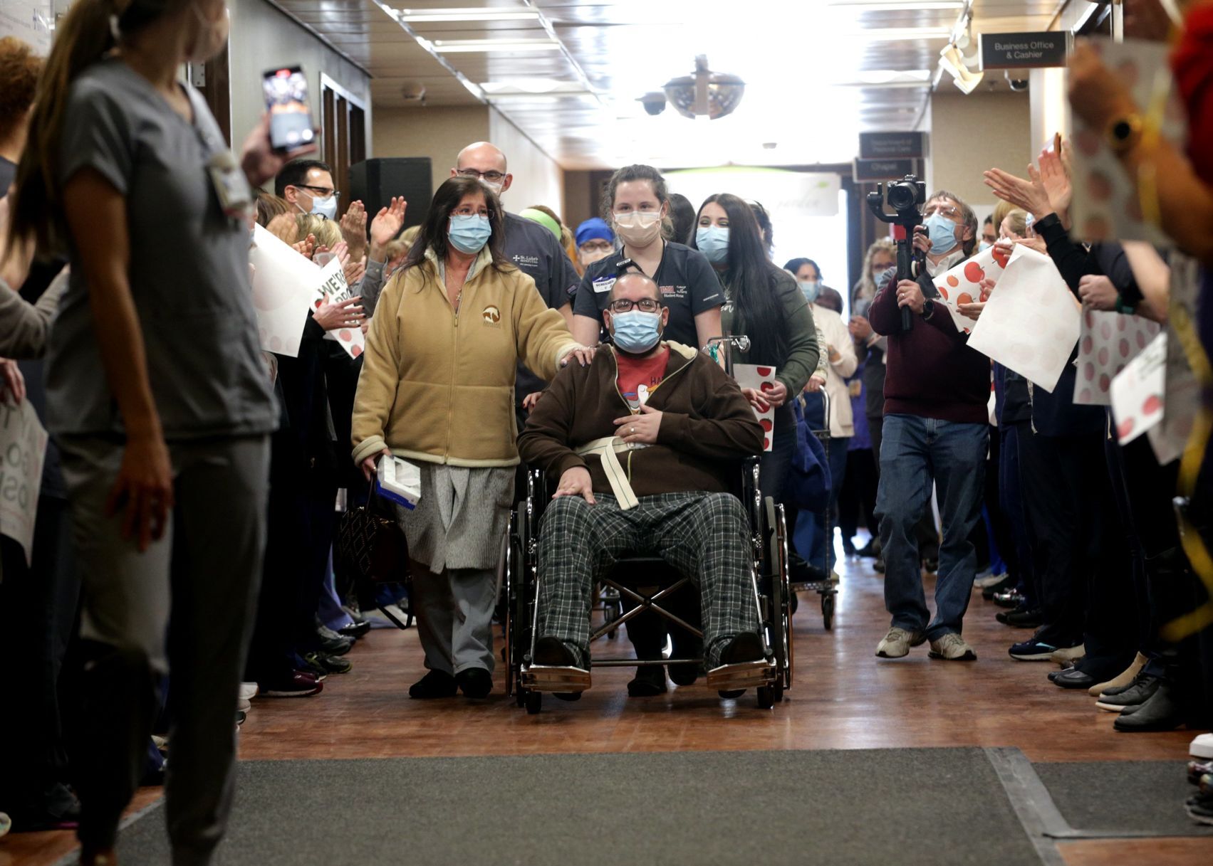 Staff cheers as COVID-19 survivor Joshua Miller discharged from St. Luke's Hospital